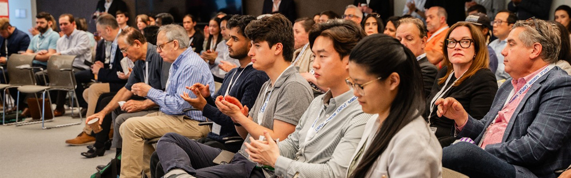 Image of a crowd sitting at a CAPCAT event