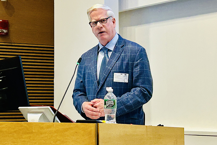 Michael Hamrock delivers remarks at a podium.