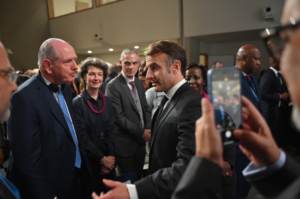 Chancellor Michael F. Collins with French President Emmanuel Macron at the WHO Academy’s opening ceremony.