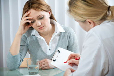 view of patient with Doctor reviewing document