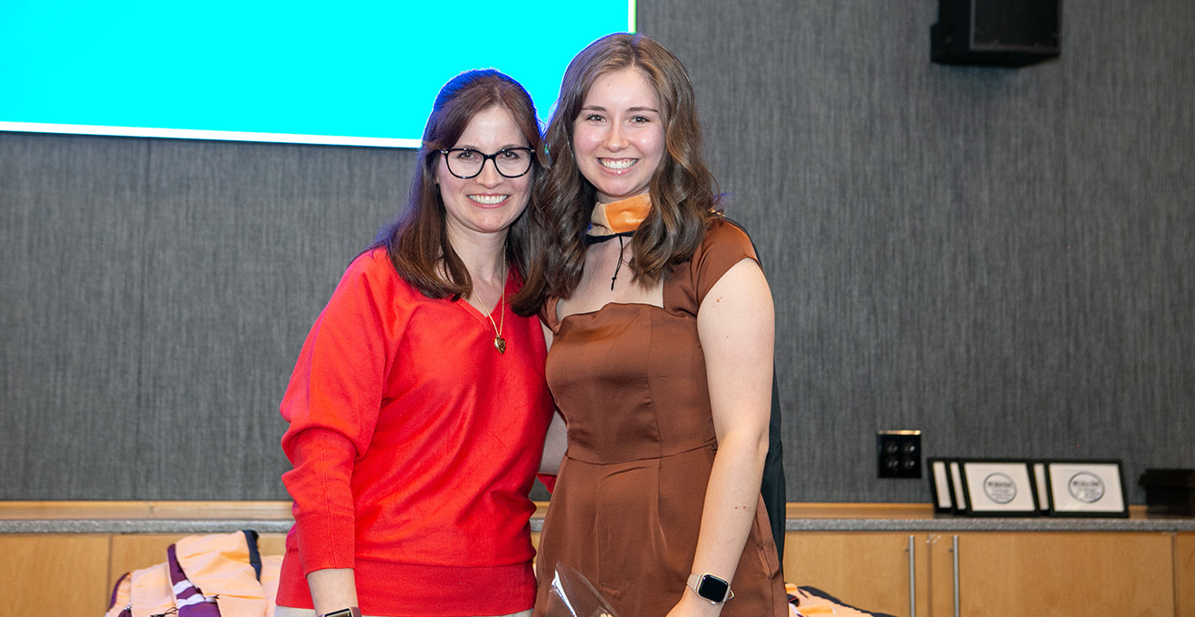 Photo of Danielle Hebert, DNP, MBA, MSN’07, ANP-BC, assistant professor of nursing and coordinator of adult-gerontology primary care nurse practitioner track, hooded her daughter, Julia Hebert, MS, BA, FNP-C, a DNP student in the Family Nurse Practitioner Track. 