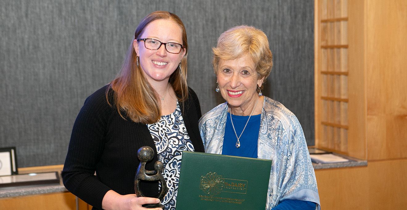 Photo of Dean Joan Vitello-Cicciu presented the Faculty Daisy Award to Amanda Cornine, PhD’21, RN, CNE, assistant professor of nursing. 