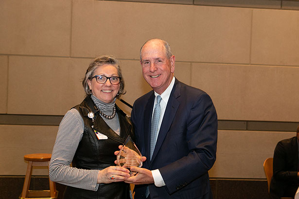 Valerie Wedge accepts the Chancellor’s Award for Advancing Institutional Excellence in Diversity and Inclusion from Chancellor Collins.