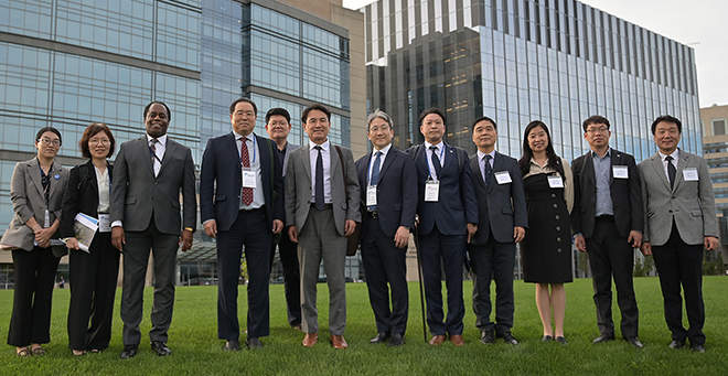 Group shot outside of the South Korean delegation with Mark Johnson